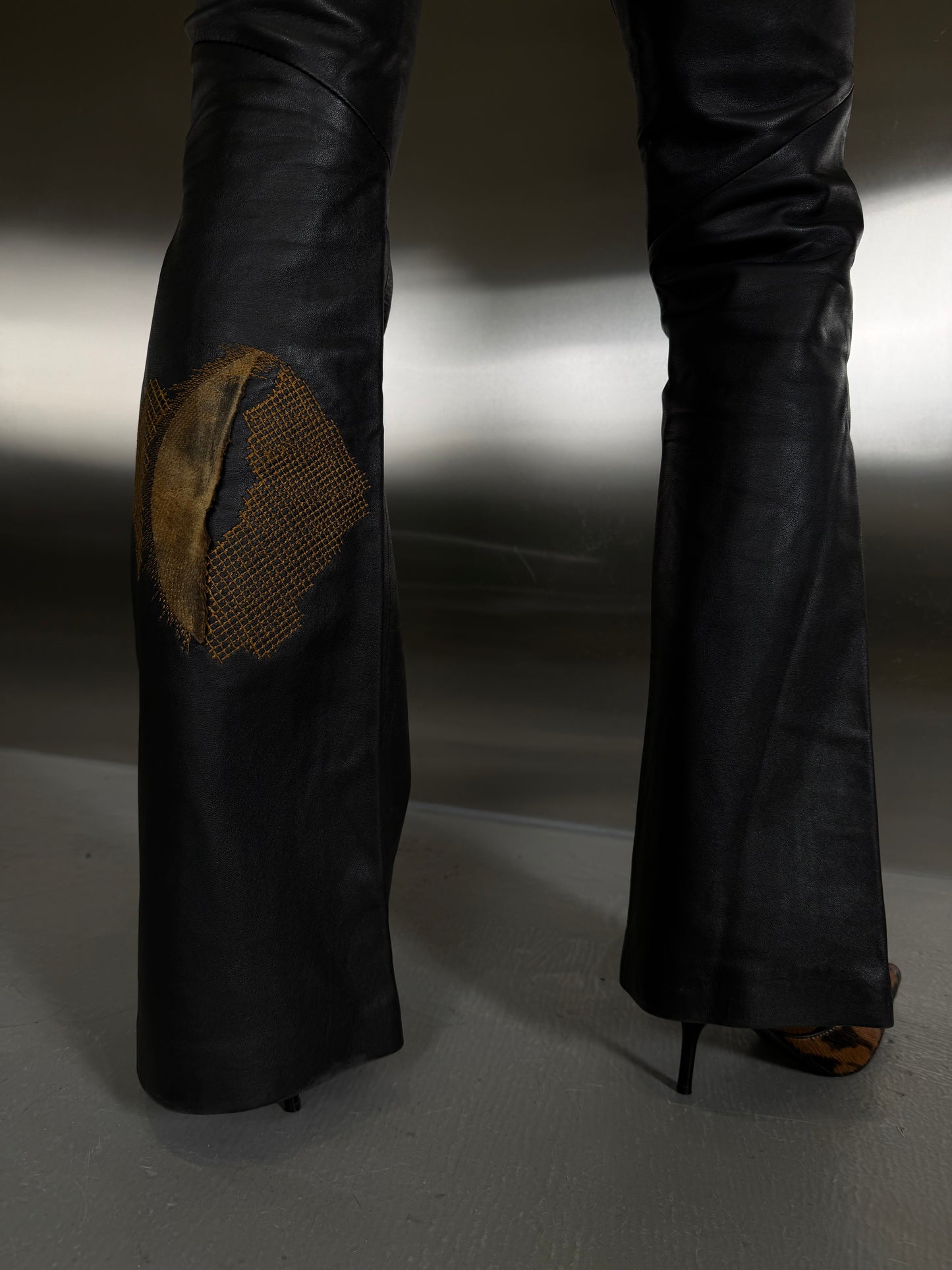 Vintage leather flared pants with patch details TWINKLING GLOBAL