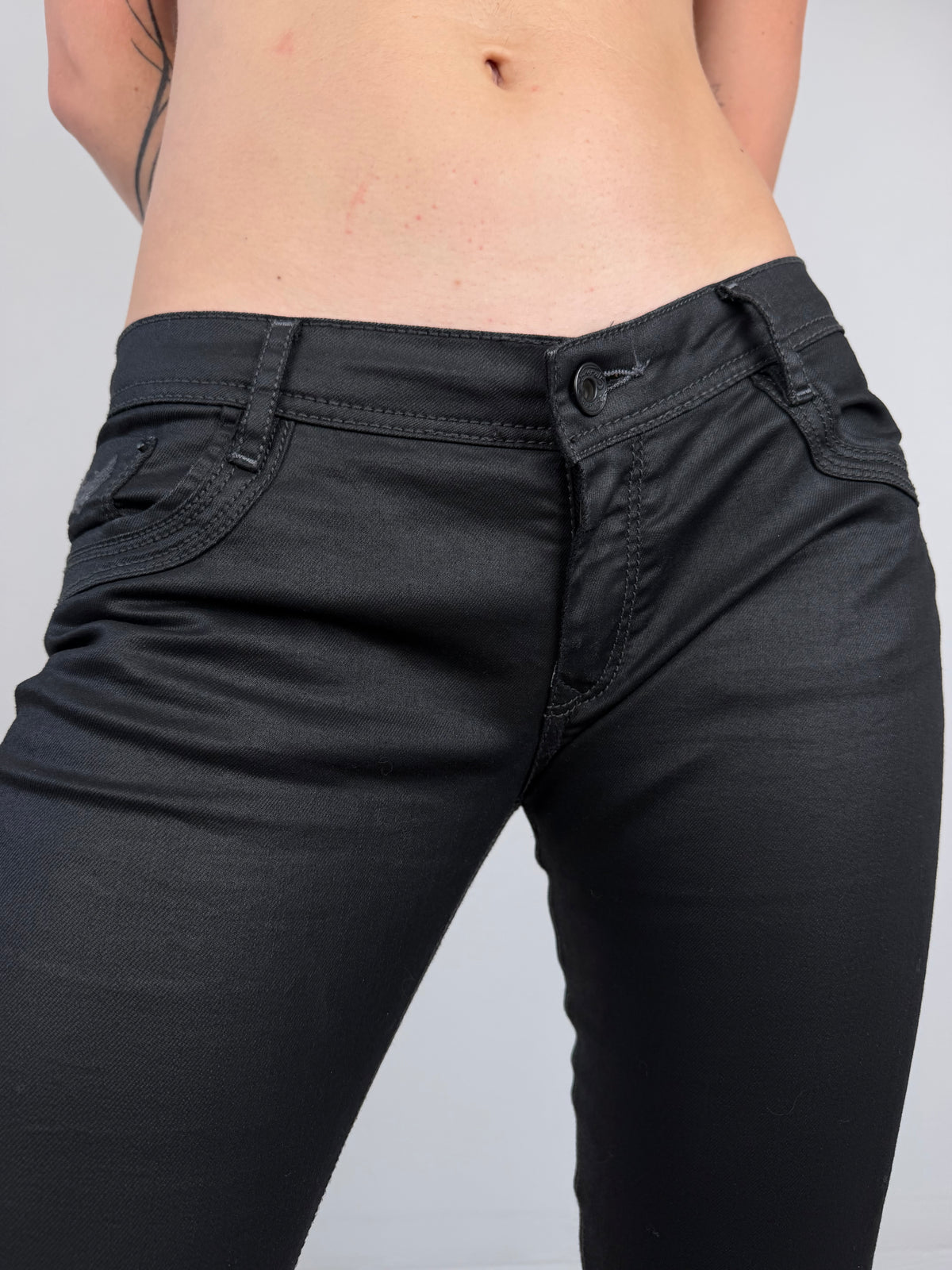 Black waxed denim jeans TWINKLING GLOBAL